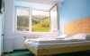 Pohodlné pokoje v Hotelu SKI s výhledem do přírody