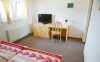 Komfortně zařízené pokoje penzionu pro pohodlí hostů