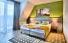 Komfortní pokoje hrají pozitivními barvami