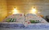 Pohodlná postel v pokoji Penzionu Rankl-Sepp na Šumavě