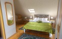 Podkrovní apartmá s rohovou vanou, Penzion Trámky, Vikýřovice, Jeseníky